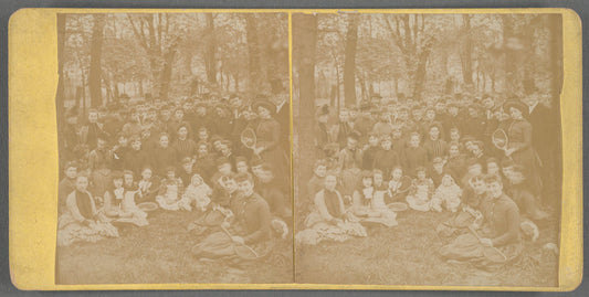 Group portrait of men, women and children with wooden tennis rackets, Ohio