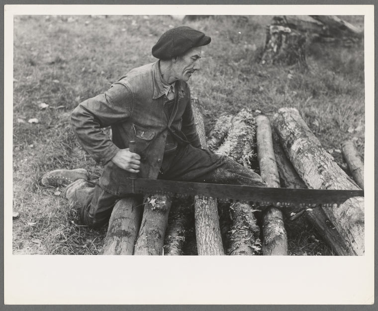 Farmer sawing wood near Bradford, Vermont