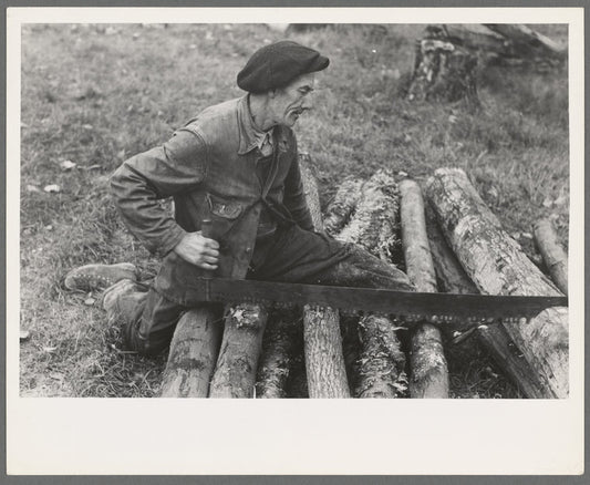 Farmer sawing wood near Bradford, Vermont