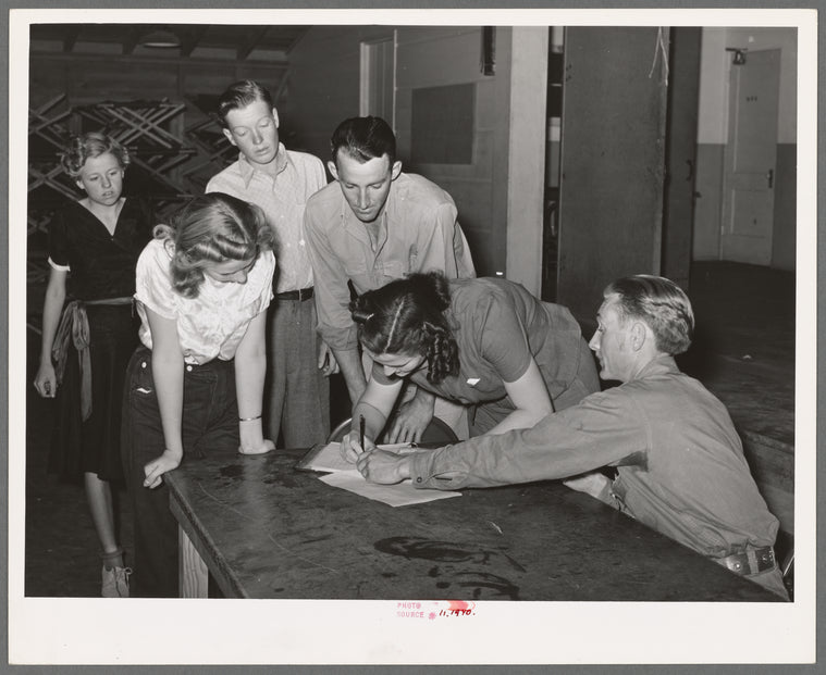 New members signing up at the young people's club at the Agua Fria migratory labor camp. Arizona