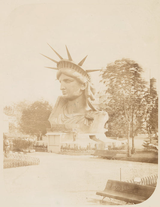 Head of the Statue of Liberty on display in a park in Paris